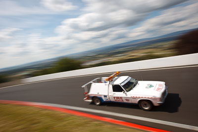 3-April-2010;Australia;Bathurst;FOSC;Festival-of-Sporting-Cars;Ford-Falcon;Mt-Panorama;NSW;New-South-Wales;auto;clouds;firechase;motion-blur;motorsport;movement;officials;racing;sky;speed;wide-angle