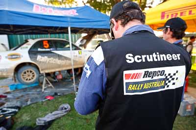 31-July-2010;APRC;Asia-Pacific-Rally-Championship;Australia;Imbil;QLD;Queensland;Sunshine-Coast;auto;motorsport;portrait;racing;scrutineer;service-centre;service-park;wide-angle