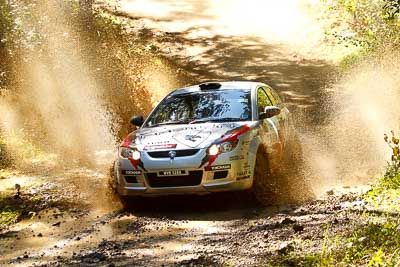 16;14-May-2011;16;APRC;Akira-Bamba;Asia-Pacific-Rally-Championship;Australia;IROQ;Imbil;International-Rally-Of-Queensland;Proton-Cusco-Rally-Team;Proton-Satria-Neo;QLD;Queensland;Sunshine-Coast;Takahiro-Yasui;auto;motorsport;racing;telephoto;water-splash