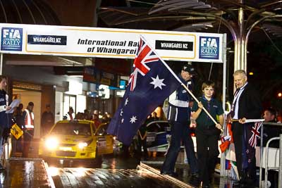 15-July-2011;APRC;Asia-Pacific-Rally-Championship;International-Rally-Of-Whangarei;NZ;New-Zealand;Northland;Rally;Whangarei;auto;ceremonial-start;ceremony;child;flag;garage;kid;motorsport;night;pre‒event;racing;start;telephoto