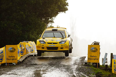 2;16-July-2011;2;APRC;Asia-Pacific-Rally-Championship;Chris-Atkinson;International-Rally-Of-Whangarei;NZ;New-Zealand;Northland;Proton-Motorsports;Proton-Satria-Neo-S2000;Rally;Stephane-Prevot;Whangarei;auto;garage;motorsport;racing;special-stage;super-telephoto