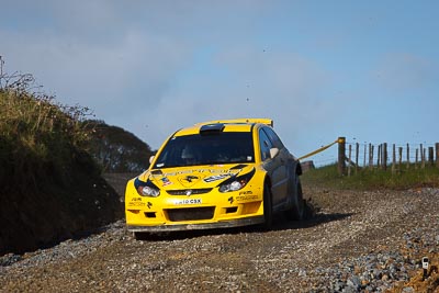 2;16-July-2011;2;APRC;Asia-Pacific-Rally-Championship;Chris-Atkinson;International-Rally-Of-Whangarei;NZ;New-Zealand;Northland;Proton-Motorsports;Proton-Satria-Neo-S2000;Rally;Stephane-Prevot;Whangarei;auto;garage;motorsport;racing;special-stage;telephoto