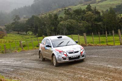 21;16-July-2011;21;APRC;Akira-Bamba;Asia-Pacific-Rally-Championship;International-Rally-Of-Whangarei;NZ;New-Zealand;Northland;Proton-Cusco-Rally-Team;Proton-Satria-Neo;Rally;Takahiro-Yasui;Whangarei;auto;garage;motorsport;racing;special-stage;telephoto