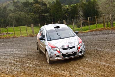 21;16-July-2011;21;APRC;Akira-Bamba;Asia-Pacific-Rally-Championship;International-Rally-Of-Whangarei;NZ;New-Zealand;Northland;Proton-Cusco-Rally-Team;Proton-Satria-Neo;Rally;Takahiro-Yasui;Whangarei;auto;garage;motorsport;racing;special-stage;telephoto