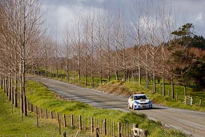 0;0;17-July-2011;APRC;Asia-Pacific-Rally-Championship;International-Rally-Of-Whangarei;NZ;New-Zealand;Northland;Rally;Safety-Car;Subaru-Impreza-WRX;Whangarei;auto;clouds;garage;motorsport;racing;sky;telephoto