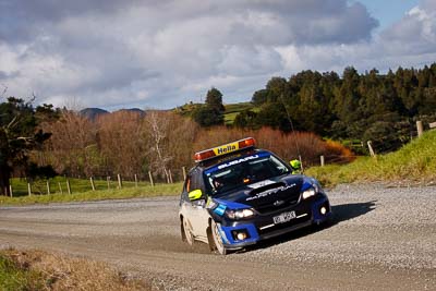 0;0;17-July-2011;APRC;Asia-Pacific-Rally-Championship;International-Rally-Of-Whangarei;NZ;New-Zealand;Northland;Rally;Safety-Car;Subaru-Impreza-WRX;Whangarei;auto;clouds;garage;motorsport;racing;sky;telephoto