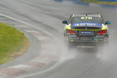 67;26-February-2012;67;Antony-Head;Australia;BMW-135i;Bathurst;Bathurst-12-Hour;John-De-Veth;Lewis-Scott;Motorsport-Services;Mt-Panorama;NSW;New-South-Wales;Todd-Murphy;auto;endurance;motorsport;racing;rain;super-telephoto;wet