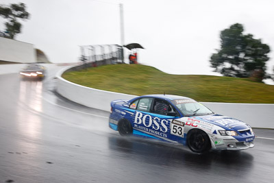 53;26-February-2012;Australia;Bathurst;Bathurst-12-Hour;Dean-Lillie;Holden-HSV-GTS;James-Atkinson;Mt-Panorama;NSW;New-South-Wales;Rick-Newman;auto;endurance;motion-blur;motorsport;racing;rain;wet;wide-angle