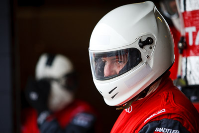 26-February-2012;Australia;Bathurst;Bathurst-12-Hour;Mt-Panorama;NSW;New-South-Wales;Phoenix-Racing;atmosphere;auto;endurance;helmet;mechanic;motorsport;paddock;pitlane;portrait;racing;telephoto