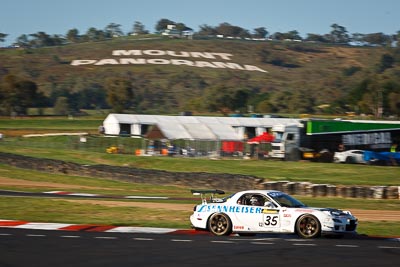 35;10-February-2013;35;Andrew-Bollom;Australia;Bathurst;Bathurst-12-Hour;Grand-Tourer;James-Parish;Mazda-RX‒7;Mazda-RX7;Mt-Panorama;Murrays-Corner;NSW;New-South-Wales;Ric-Shaw;Ric-Shaw-Racing;Stephen-Borness;auto;endurance;motorsport;racing;telephoto