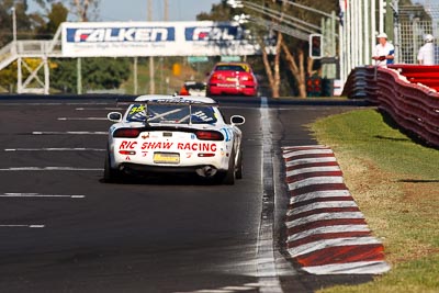 35;10-February-2013;35;Andrew-Bollom;Australia;Bathurst;Bathurst-12-Hour;Grand-Tourer;James-Parish;Mazda-RX‒7;Mazda-RX7;Mt-Panorama;Murrays-Corner;NSW;New-South-Wales;Ric-Shaw;Ric-Shaw-Racing;Stephen-Borness;auto;endurance;motorsport;racing;super-telephoto