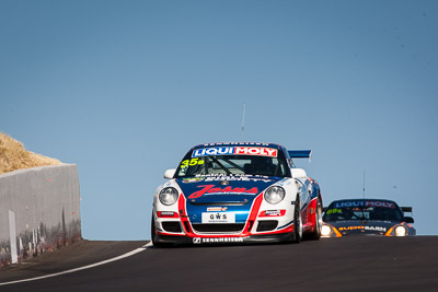 35;35;8-February-2014;Aaron-Zerefos;Andrew-Fisher;Australia;Bathurst;Bathurst-12-Hour;Indiran-Padayachee;NSW;New-South-Wales;Porsche-997-GT3-Cup;Ric-Shaw;SennheiserRentcorp-ForkliftsFiji-Water;auto;endurance;motorsport;racing;sky;super-telephoto