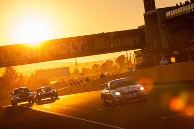 35;35;9-February-2014;Aaron-Zerefos;Andrew-Fisher;Australia;Bathurst;Bathurst-12-Hour;Indiran-Padayachee;NSW;New-South-Wales;Porsche-997-GT3-Cup;Ric-Shaw;SennheiserRentcorp-ForkliftsFiji-Water;auto;endurance;motorsport;racing;sunrise;telephoto